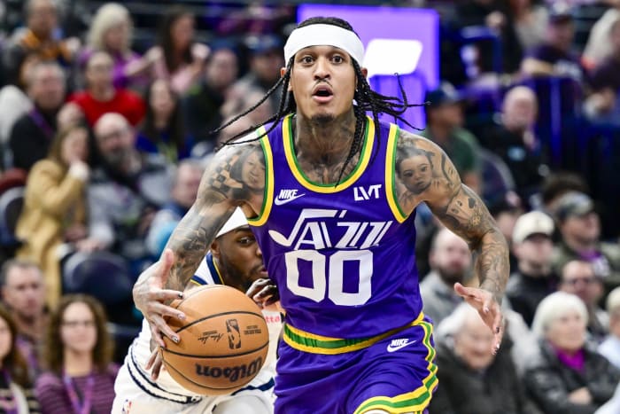 Jan 10, 2024; Salt Lake City, Utah, USA; Denver Nuggets forward/guard Justin Holiday (9) reaches for the ball by Utah Jazz guard Jordan Clarkson (00) during the second half at the Delta Center.